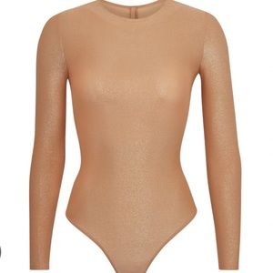 Skims shimmer body suit. Never worn.